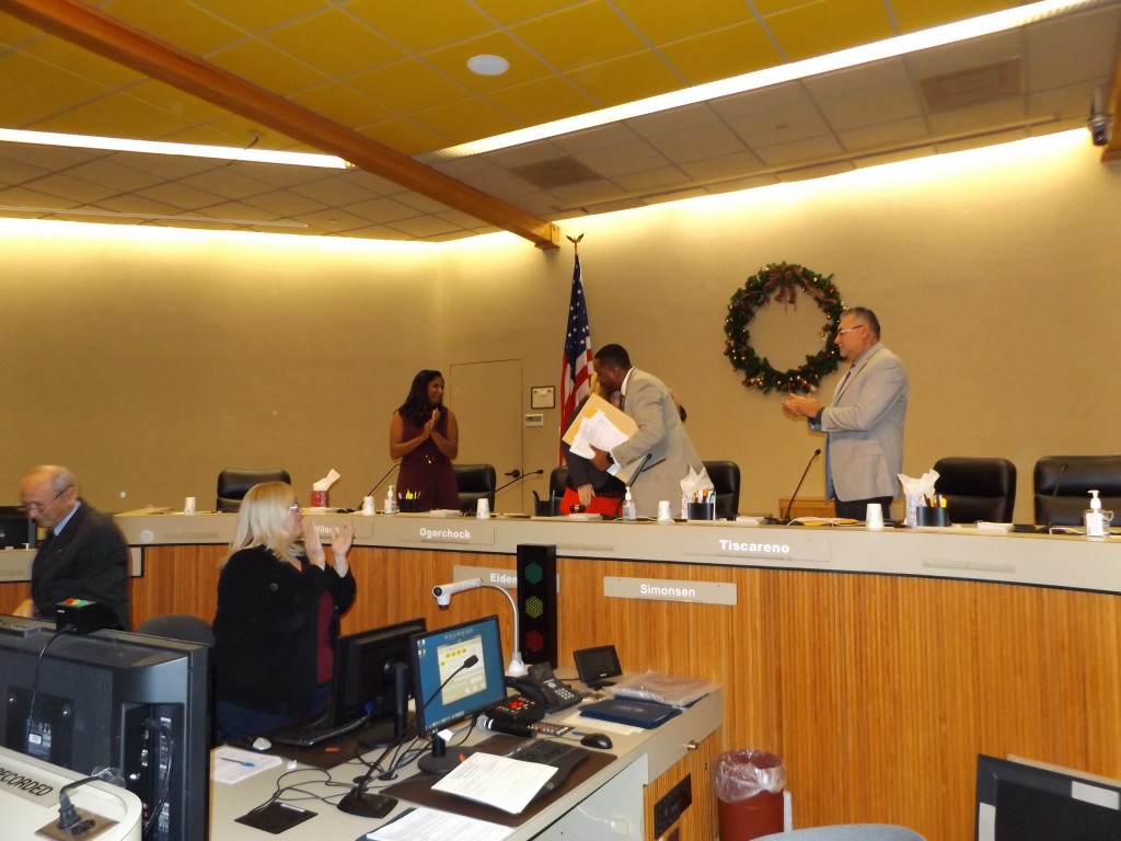 Out-going Mayor Wade Harper is hugged by then-Mayor Pro Tem Lori Ogorchock as he leaves the Council dais for the final time on Thursday, December 8, 2016.