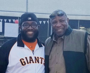 Kangazoom owner-manager Marcus Jefferson enjoys a moment with Dusty Baker.