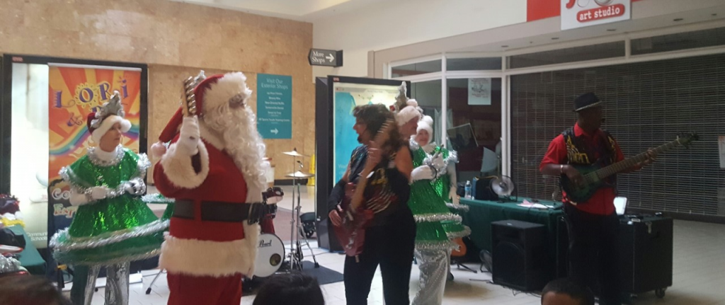 Santa rocks out with Lori, RJ and the Dancing Trees at Somersville Towne Center in Antioch, Saturday, December 10, 2016. Photo courtesy STC