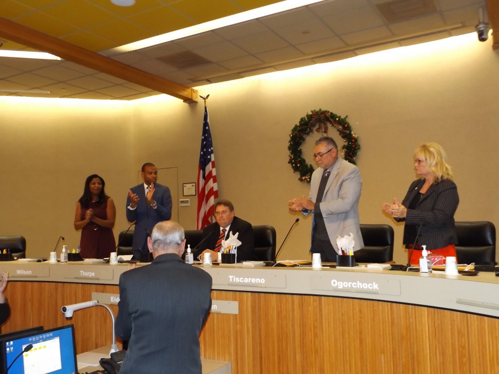 Antioch's new Mayor Sean Wright receives a standing ovation from his fellow council members, City Clerk Arne Simonsen and the audience after taking his seat and the reorganization of the council, Thursday night, December 8, 2016.