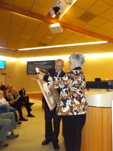 City Clerk Arne Simonsen presents out-going Councilwoman Mary Rocha with a photo from First 5 of Contra Costa.