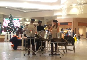 The Soca Sisters and Company steel pan band performed for holiday shoppers at the mall.