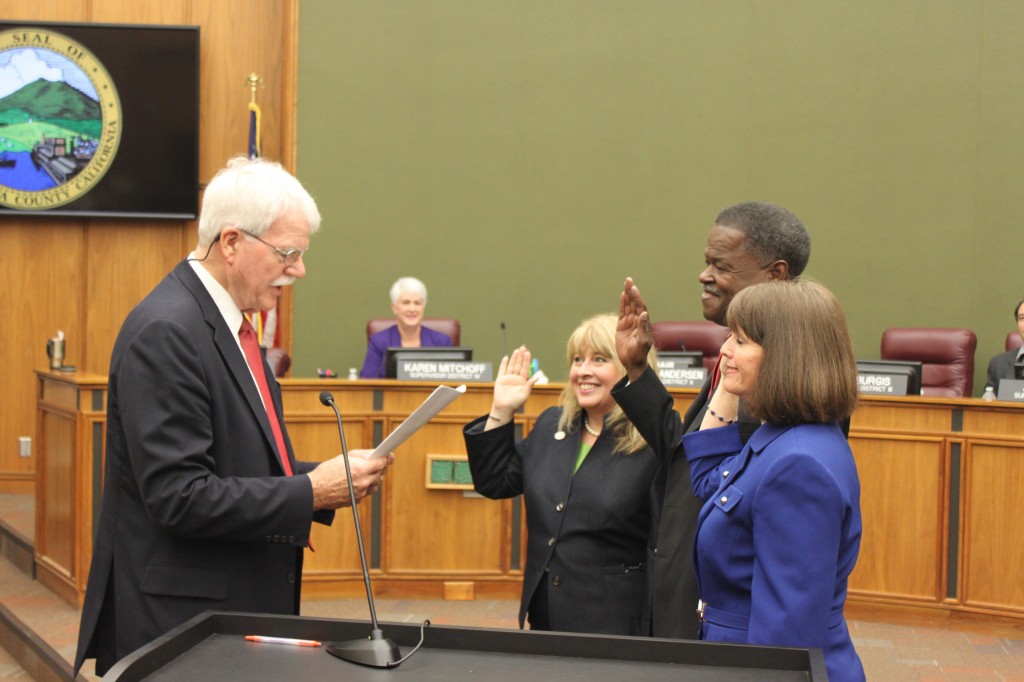 Former Congressman George Miller administers the oaths of office to new Contra Costa County Supervisor Diane Burgis, left, and re-elected Supervisors Federal Glover and Candace Andersen, Tuesday, January 10, 2017 as Supervisors Karen Mitchoff and John Gioia look on. photos by Jonathan Bash