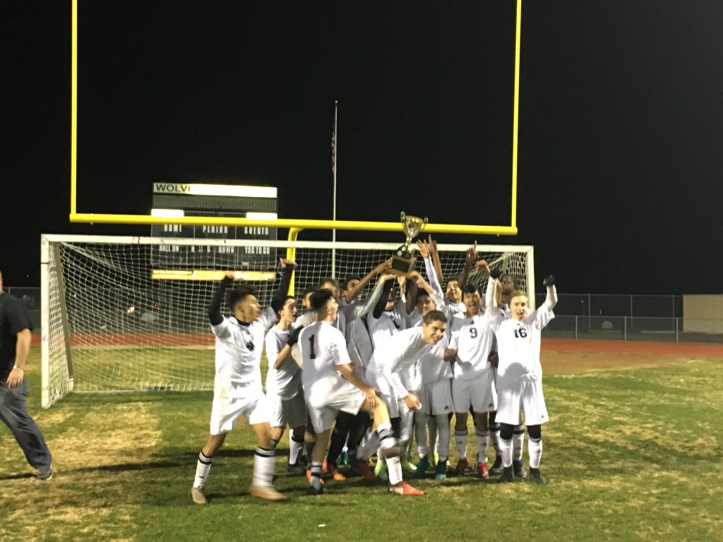 Deer Valley High boys soccer team celebrates retaining the Mayor's Cup following the match with Antioch High, Tuesday night, Jan. 31, 2017. photo by Jesus Cano